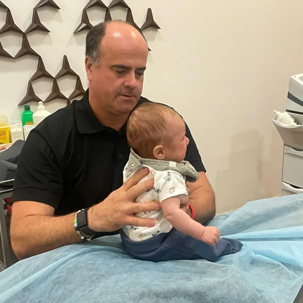 Osteopath in Dubai, Thomas Wynn-Jones, treating baby